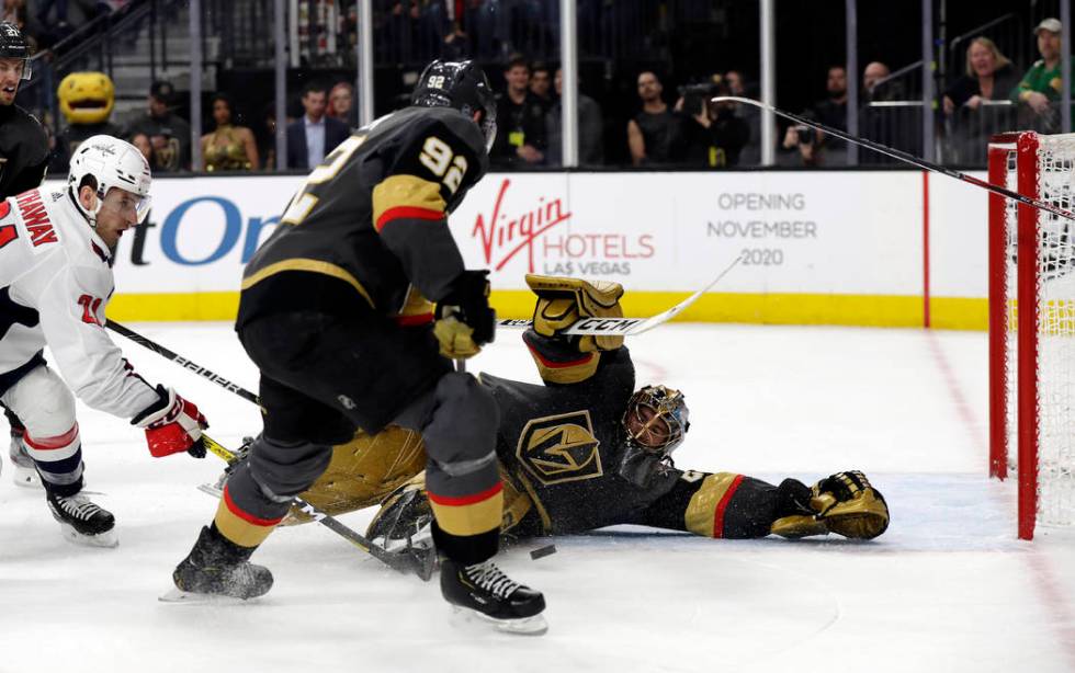 Vegas Golden Knights goalie Marc-Andre Fleury stops a shot from Washington Capitals forward Gar ...