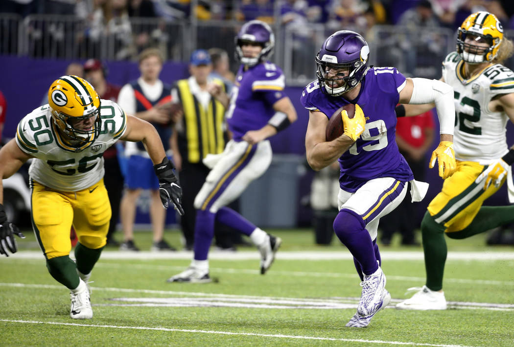 Minnesota Vikings wide receiver Adam Thielen (19) runs from Green Bay Packers inside linebacker ...