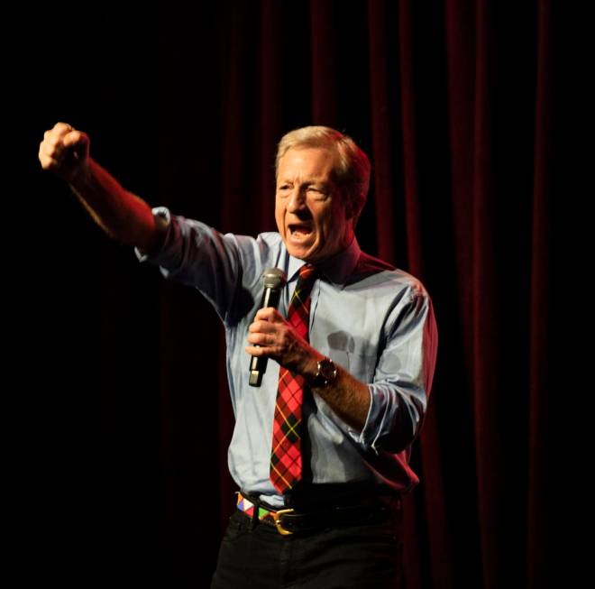 Democratic presidential candidate Tom Steyer leads a chant stating "we demand justice,&quo ...