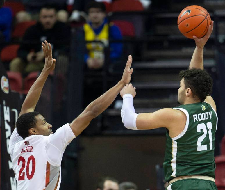 UNLV Rebels forward Nick Blair (20) extends to block the shot of Colorado State Rams guard Davi ...