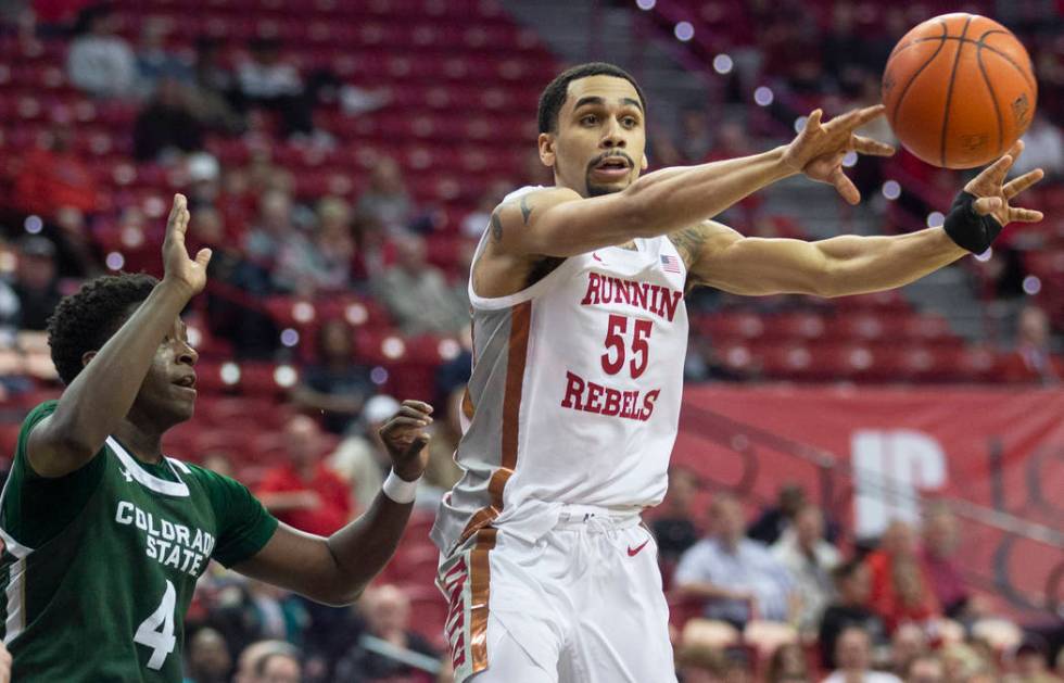 UNLV Rebels guard Elijah Mitrou-Long (55) runs the fast break with Colorado State Rams guard Is ...