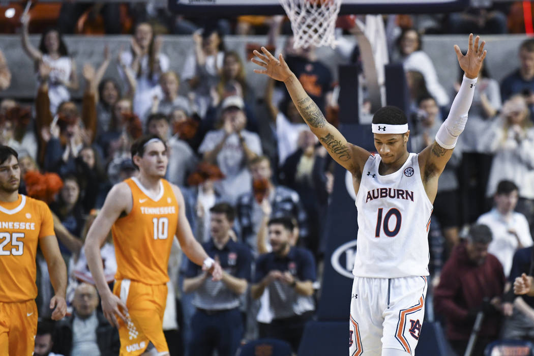 Auburn guard Samir Doughty (10) reacts after the final second of the win over Tennessee in an N ...