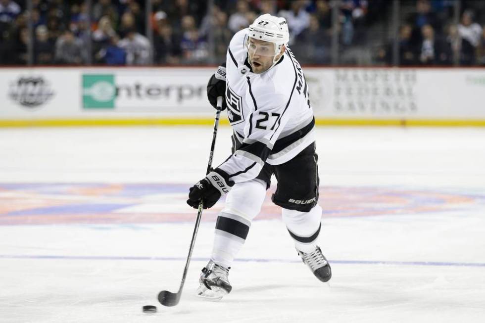 Los Angeles Kings' Alec Martinez shoots during the first period of the team's NHL hockey game a ...