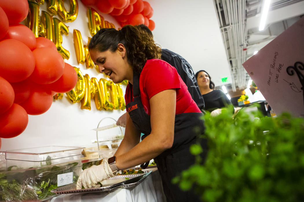 Claudia Andracki, owner of Desert Bloom Eco Farm, prepares food during a culinary celebration h ...