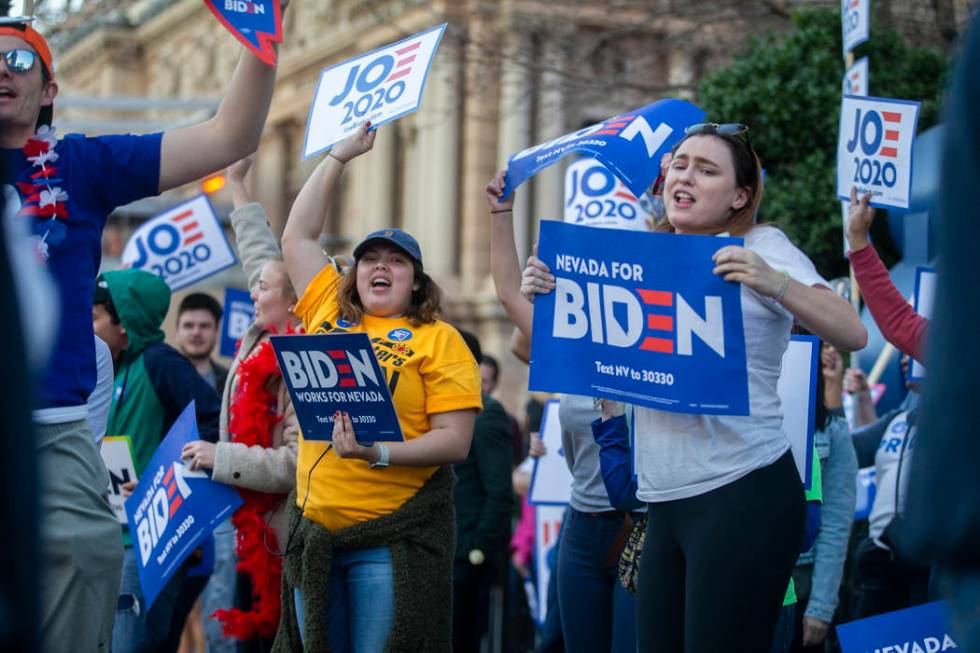 Supporters of Democratic presidential candidate former Vice President Joe Biden wave signs on t ...