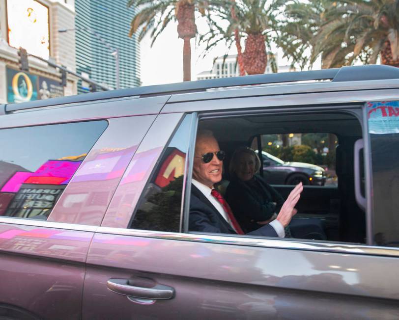 Democratic presidential candidate former Vice President Joe Biden, left, waves to supporters be ...