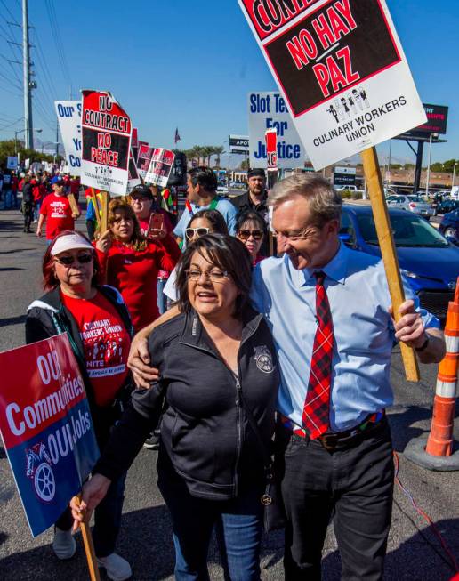 Democratic presidential candidate businessman Tom Steyer, right, walks with Alma Too of the Tea ...