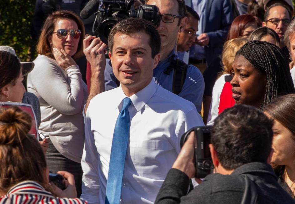 Democratic presidential candidate former South Bend, Ind. Mayor Pete Buttigieg talks with worke ...