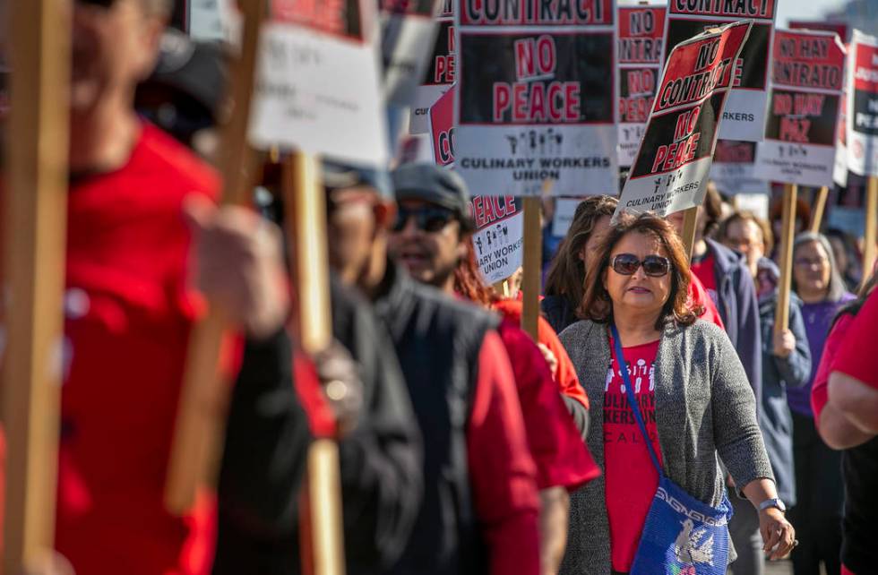 Workers from seven Station Casinos' properties walk a picket line while fighting for a union co ...