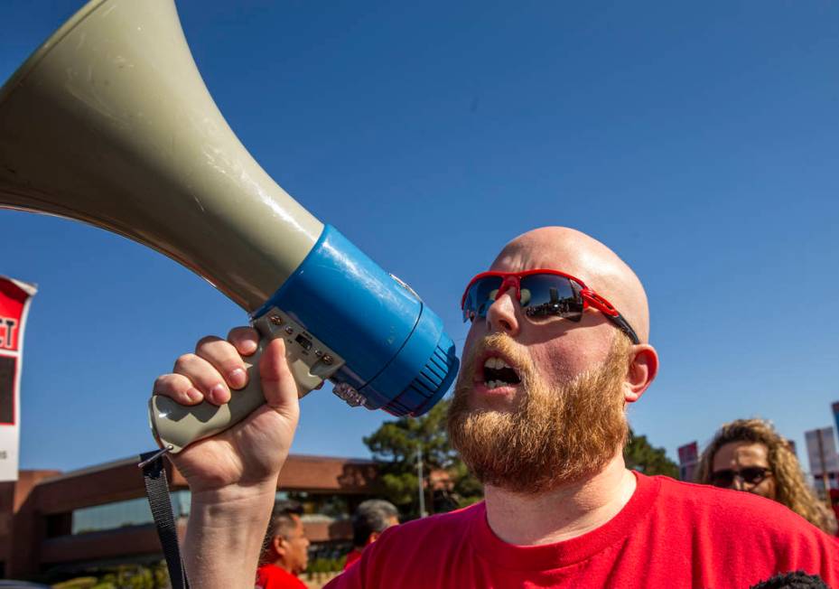 Jacob George with the Culinary Local Union 226 shouts out slogans for workers from seven Statio ...