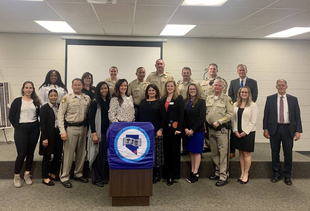 Law enforcement and local advocacy groups gathered at the Southern Nevada Family Justice Center ...