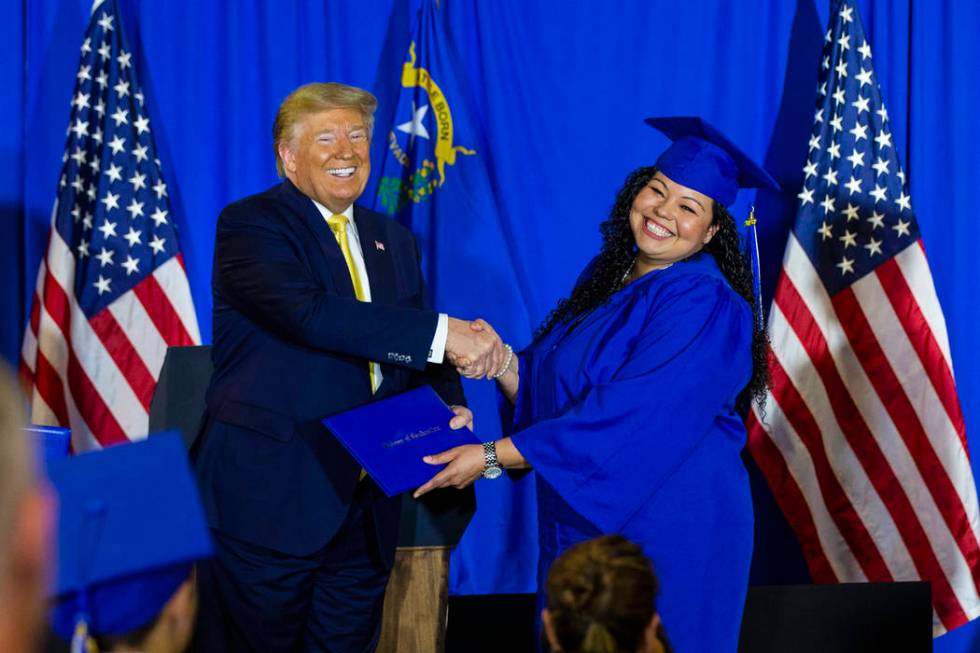 President Donald Trump hands out diplomas during a graduation ceremony for participants of the ...
