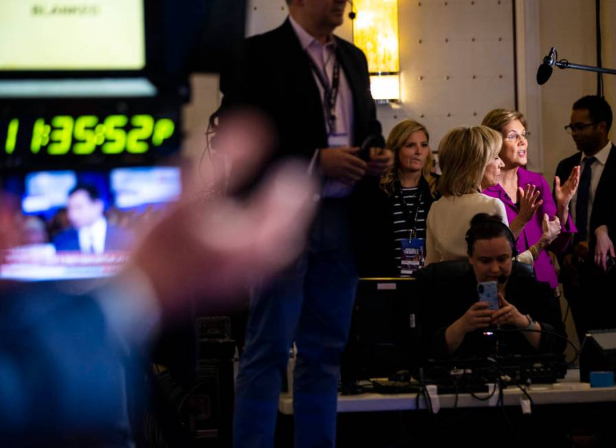 Democratic presidential candidate Sen. Elizabeth Warren, D-Mass., right, speaks as former South ...