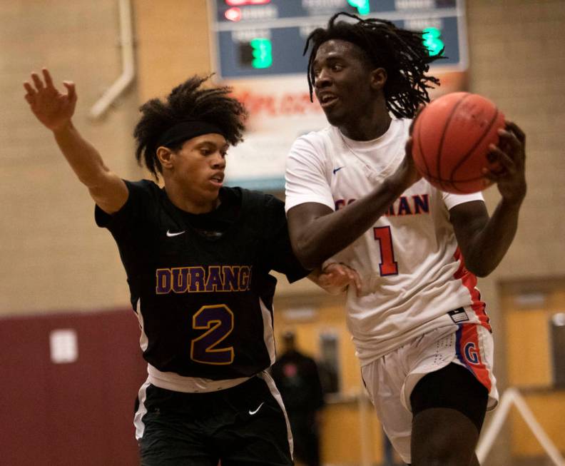 Durango's Elijah Johnson (2) defends against Bishop Gorman's Will McClendon (1) at Desert Oasis ...