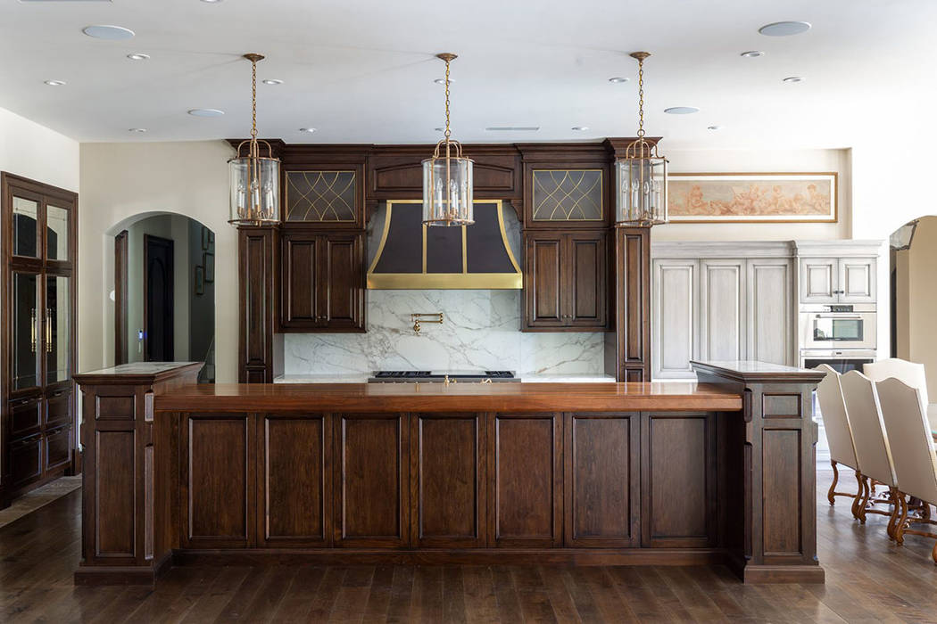 The kitchen is adjacent to the living room and has all the latest appliances. (Ivan Sher Group)