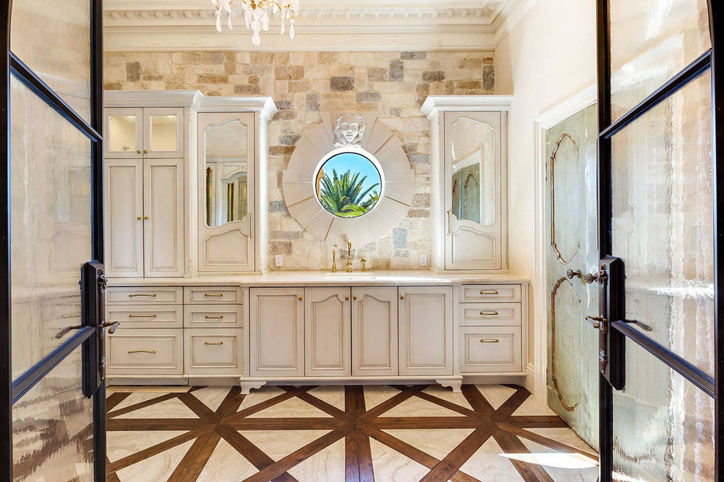 The spa-inspired bath features 24-karat gold fixtures. (Ivan Sher Group)