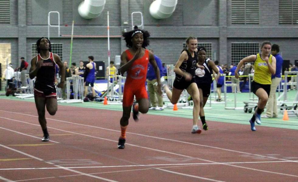 Bloomfield High School transgender athlete Terry Miller, second from left, wins the final of th ...