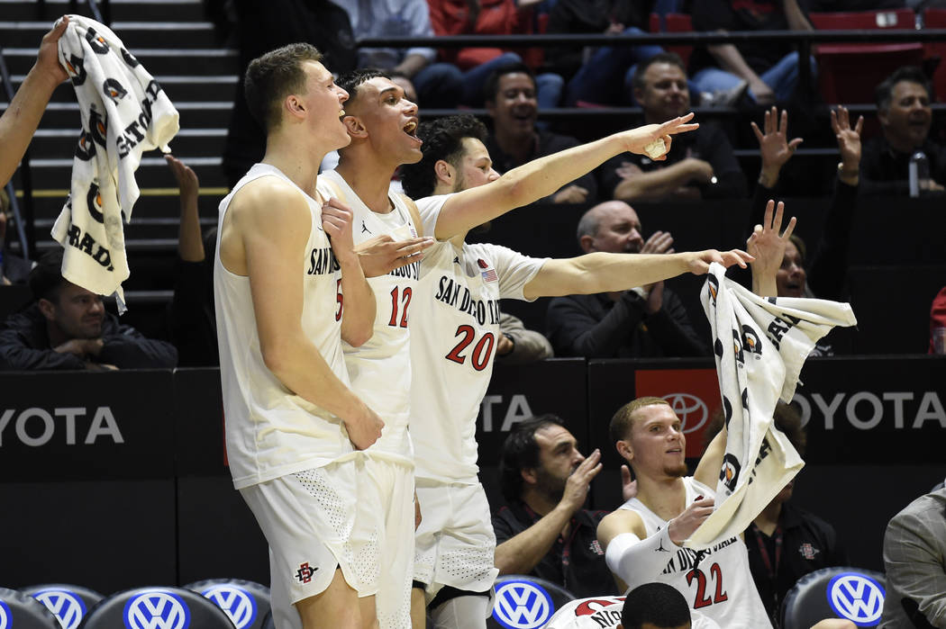 San Diego State forward Yanni Wetzell (5), Matt Mitchell (11), Jordan Schakel (20) and Malachi ...