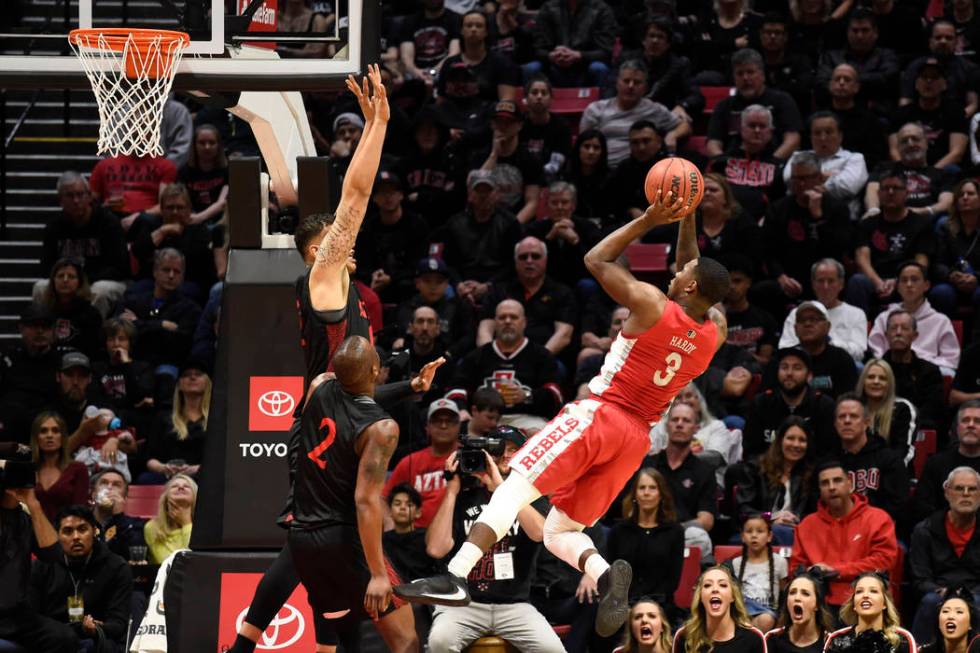 UNLV guard Amauri Hardy (3) shoots over San Diego State forward Nolan Narain (12) during the fi ...