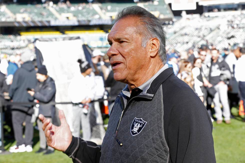 Former Oakland Raiders quarterback Jim Plunkett before the start of an NFL football game betwee ...