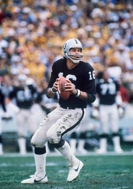 Oakland Raiders quarterback Jim Plunkett (16) prepares to throw the ball in a game against the ...