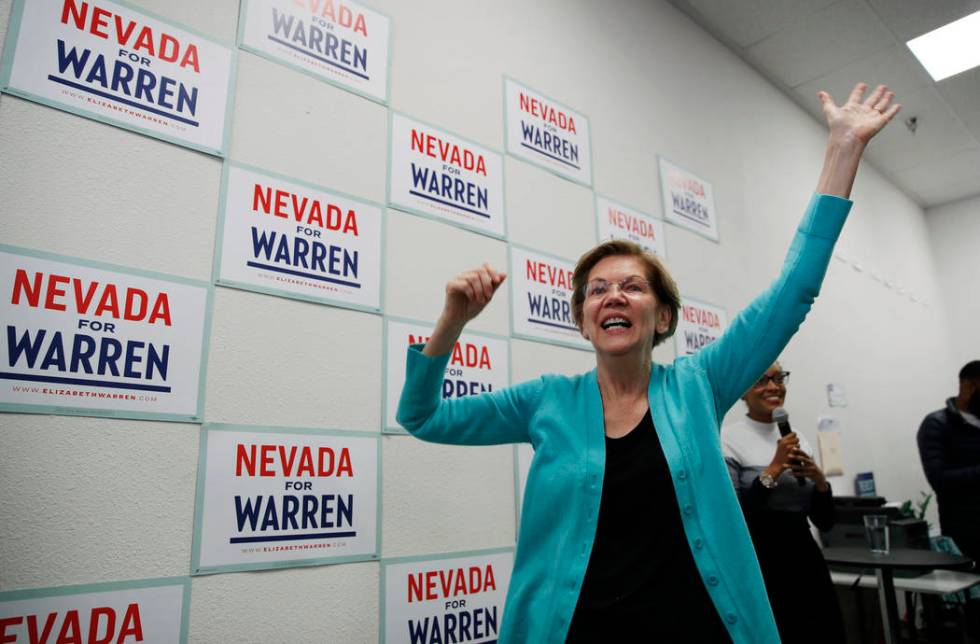 Democratic presidential candidate Sen. Elizabeth Warren, D-Mass., reacts as she speaks at a cam ...