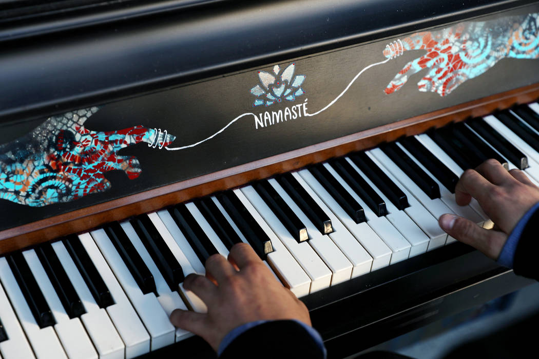 Jules Kessler, 14, plays a donated piano during the grand opening of dT-Alley in Las Vegas on ...