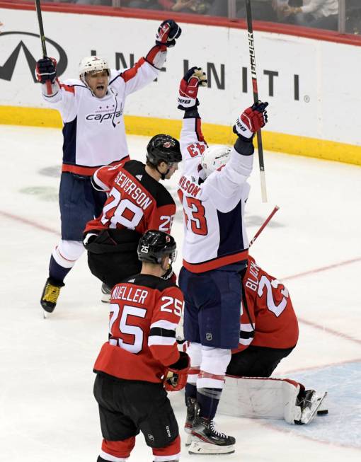 Washington Capitals right wing Tom Wilson (43) celebrates his goal with left wing Alex Ovechkin ...