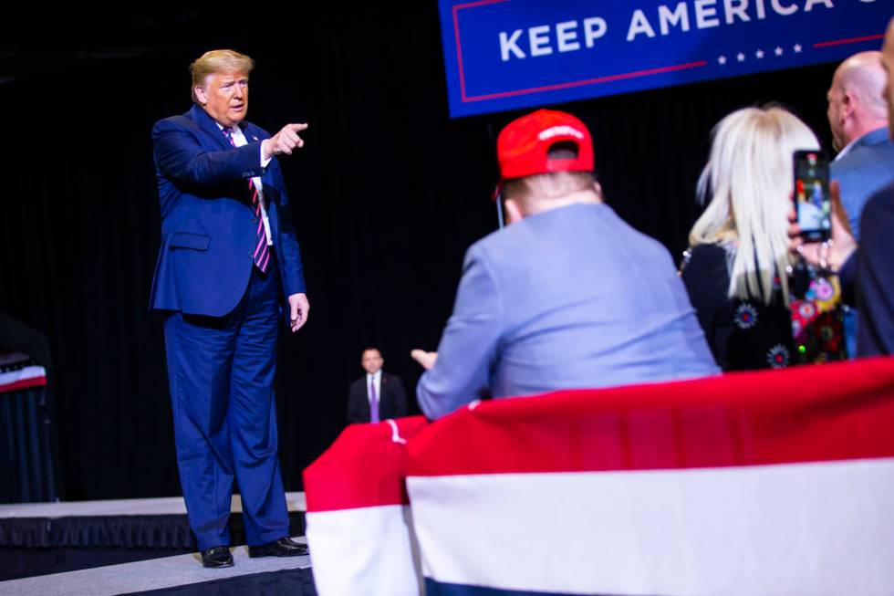 President Donald Trump arrives for a rally at the Las Vegas Convention Center in Las Vegas on F ...