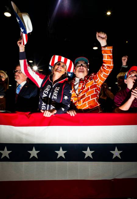 Supporters of President Donald Trump, not pictured, cheer as Vice President Mike Pence speaks a ...