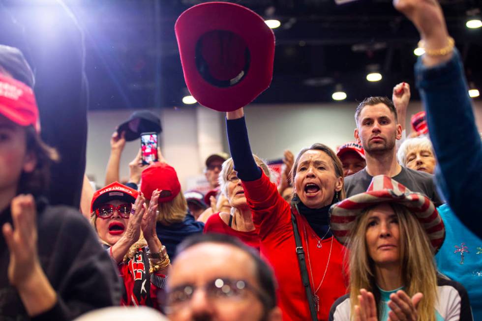 Supporters of President Donald Trump, not pictured, cheer as Vice President Mike Pence speaks a ...