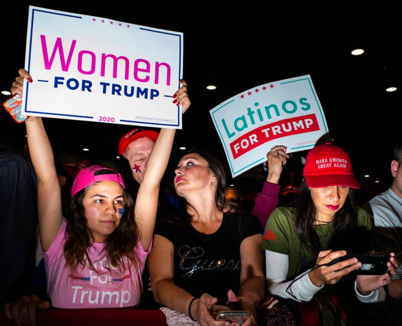 Supporters of President Donald Trump, not pictured, cheer before his arrival at a rally at the ...