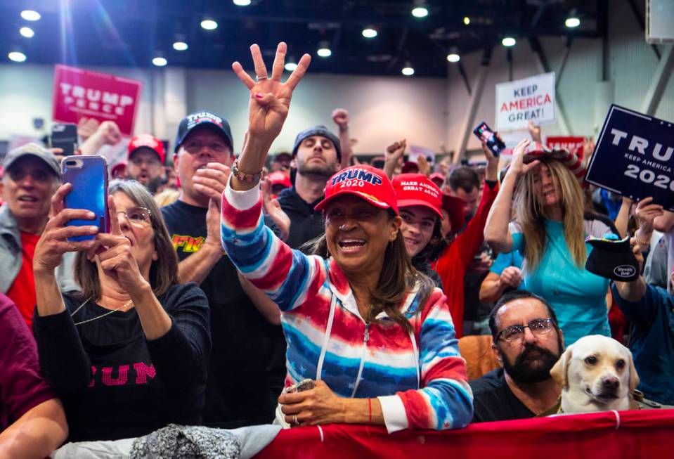 Supporters of President Donald Trump, not pictured, cheer as Vice President Mike Pence speaks a ...