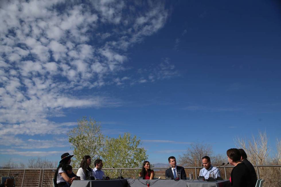 Democratic presidential candidate former South Bend, Ind., Mayor Pete Buttigieg, center, partic ...