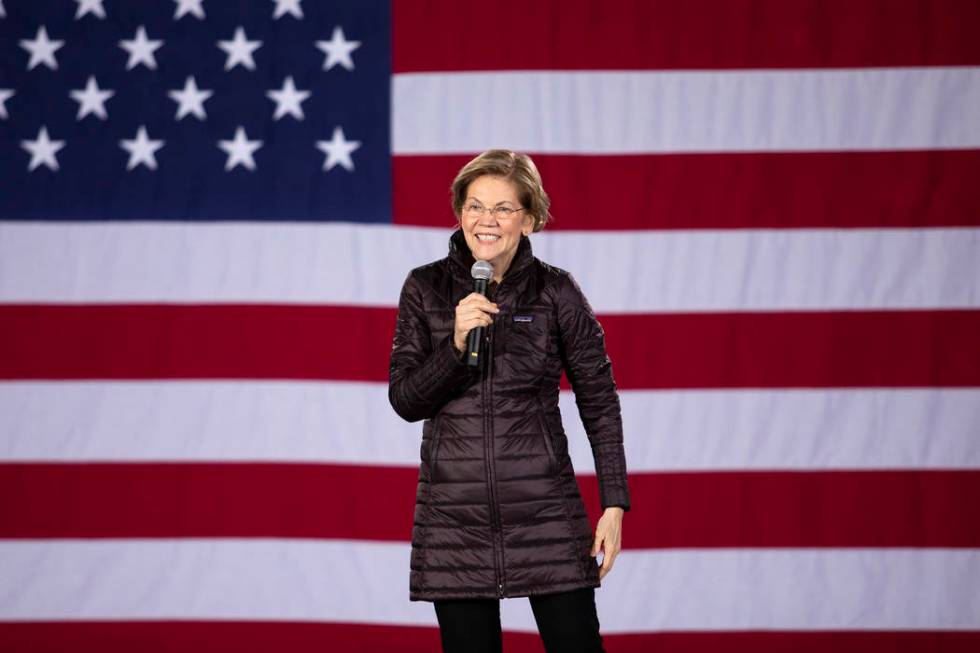 Sen. Elizabeth Warren, D-Mass., speaks to the crowd at her "Get Out the Caucus Block Party ...