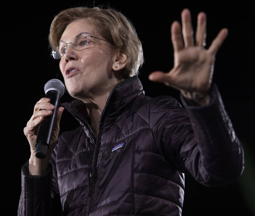 Sen. Elizabeth Warren, D-Mass., speaks to the crowd at her "Get Out the Caucus Block Party ...