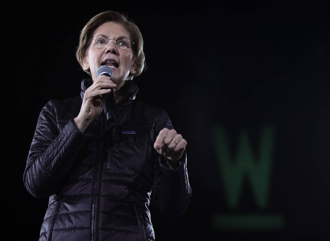 Sen. Elizabeth Warren, D-Mass., speaks to the crowd at her "Get Out the Caucus Block Party ...