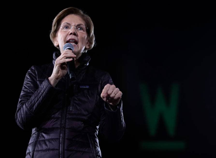 Sen. Elizabeth Warren, D-Mass., speaks to the crowd at her "Get Out the Caucus Block Party ...