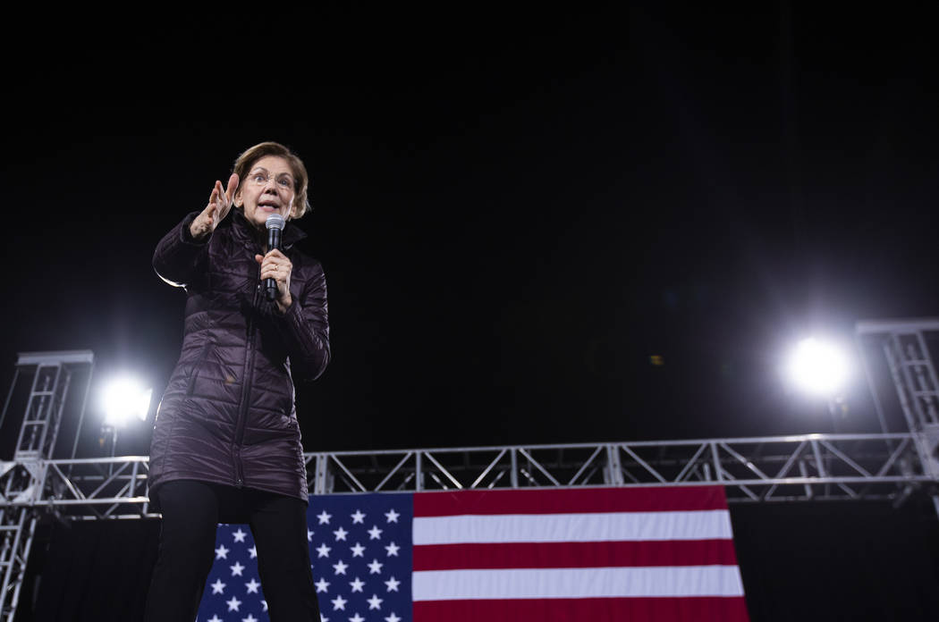 Sen. Elizabeth Warren, D-Mass., speaks to the crowd at her "Get Out the Caucus Block Party ...