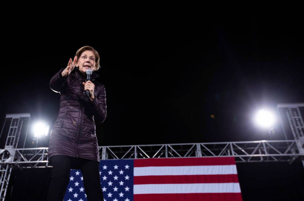 Sen. Elizabeth Warren, D-Mass., speaks to the crowd at her "Get Out the Caucus Block Party ...