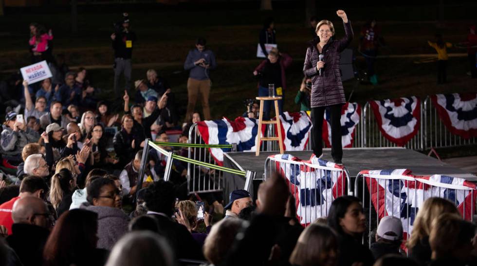 Sen. Elizabeth Warren, D-Mass., speaks to the crowd at her "Get Out the Caucus Block Party ...