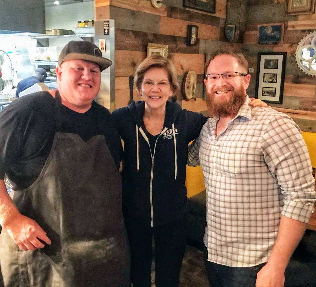 Sen. Elizabeth Warren is shown with Esther's Kitchen chef/owner James Trees, left, and GM Dylan ...