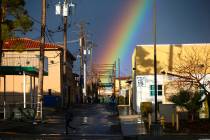 A rainbow rises above Maryland Parkway after rain in downtown Las Vegas on Saturday, Feb. 22, 2 ...