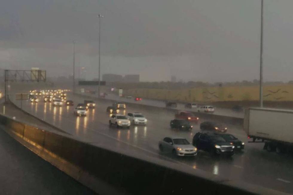 Rain pours down in Las Vegas at on U.S. Highway 95 near Valley View Boulevard, Saturday afterno ...