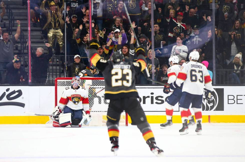 Golden Knights' Alec Martinez (23) celebrates a goal by teammate Max Pacioretty, not pictured, ...