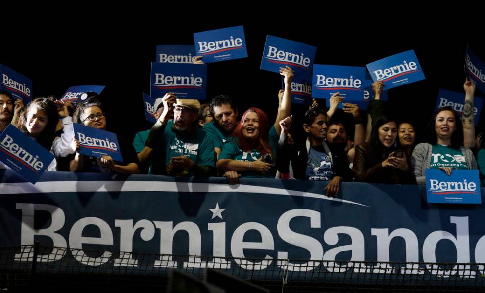 Supporters of Democratic presidential candidate Sen. Bernie Sanders, I-Vt., cheer as they watch ...