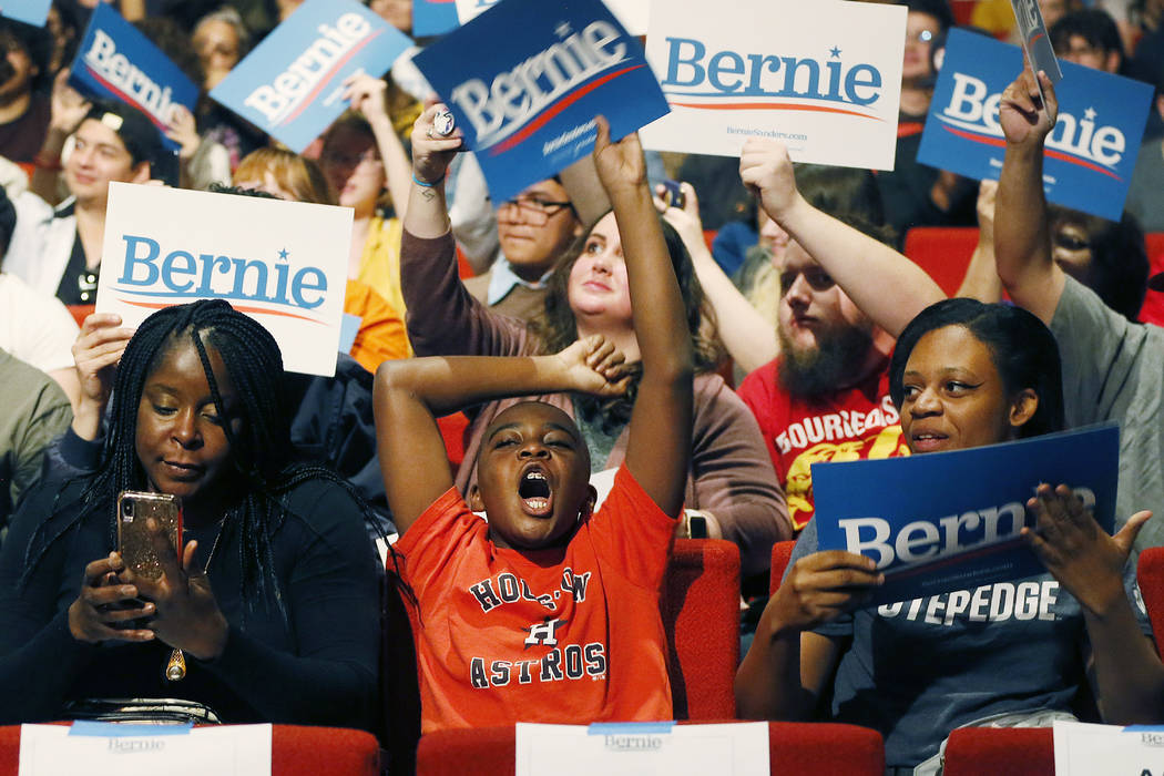 Igwe Chukwu, a supporter for Democratic presidential candidate Sen. Bernie Sanders, I-Vt., chee ...