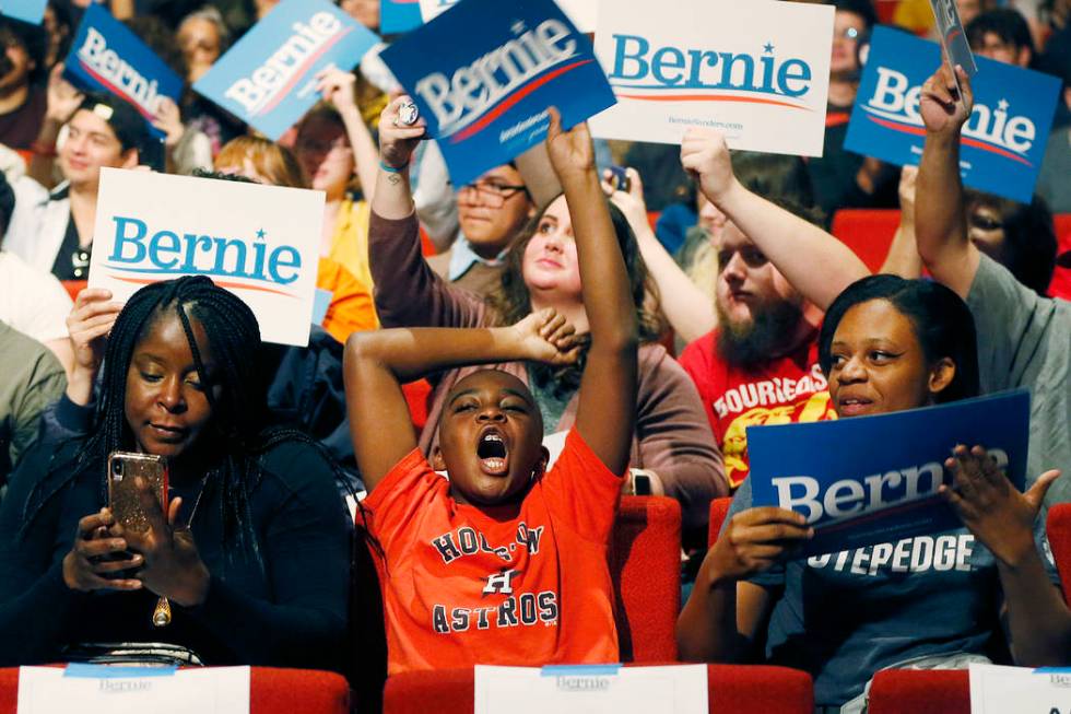 Igwe Chukwu, a supporter for Democratic presidential candidate Sen. Bernie Sanders, I-Vt., chee ...