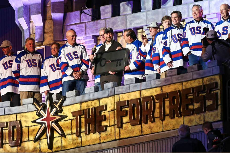 Clark County Commissioner Michael Naft, center, honors the members of the gold medal 1980 &quot ...