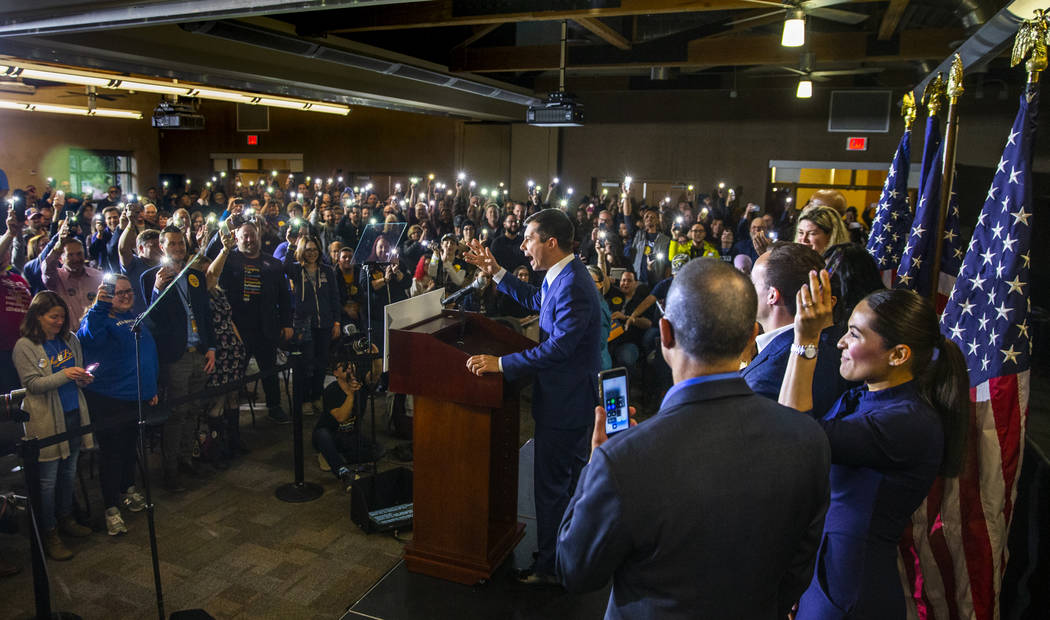 Members of the crowd hold up their lit phones in support as Democratic presidential candidate a ...